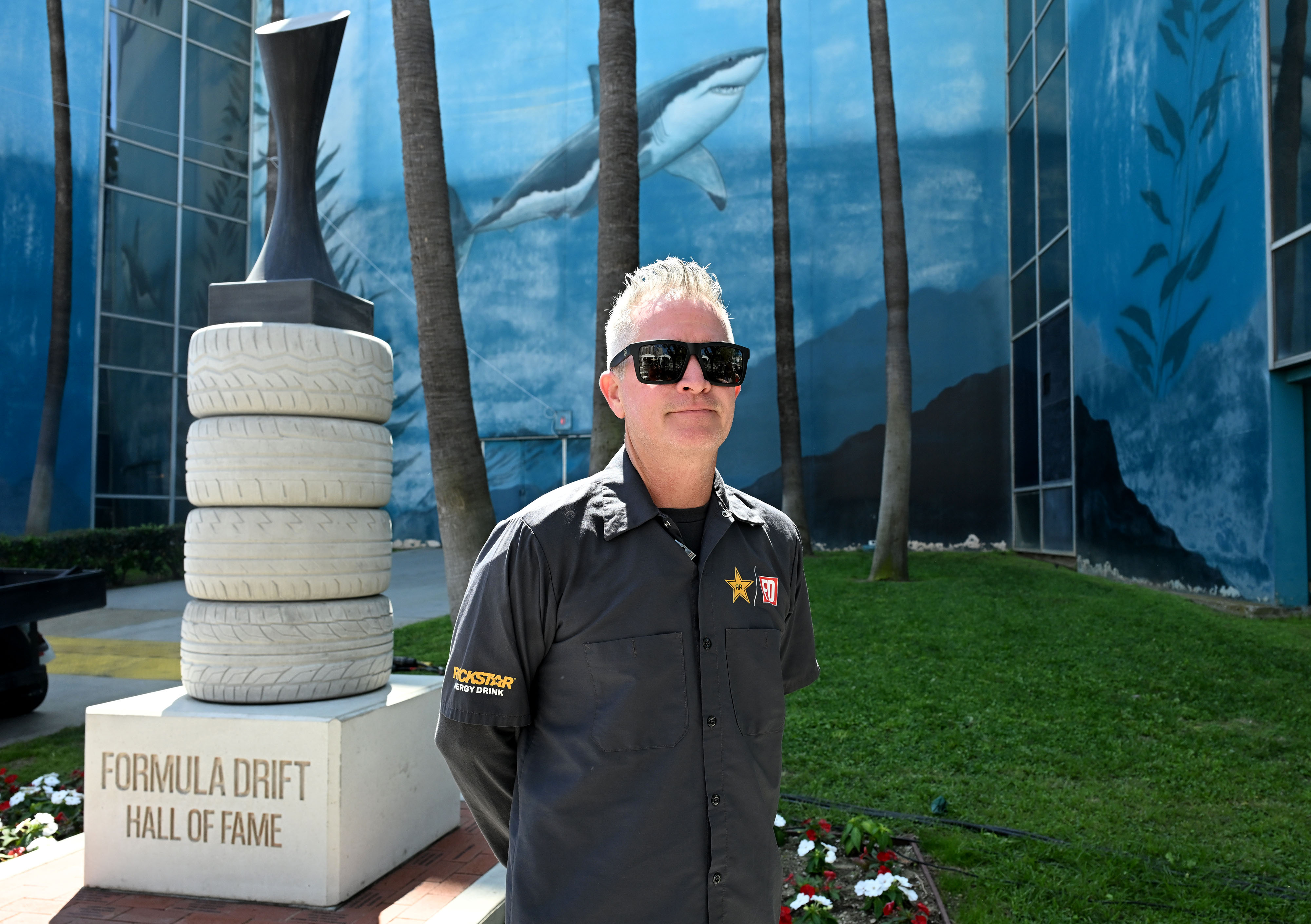 Artist, Kevin Wells, poses following the unveiling of the Formula...