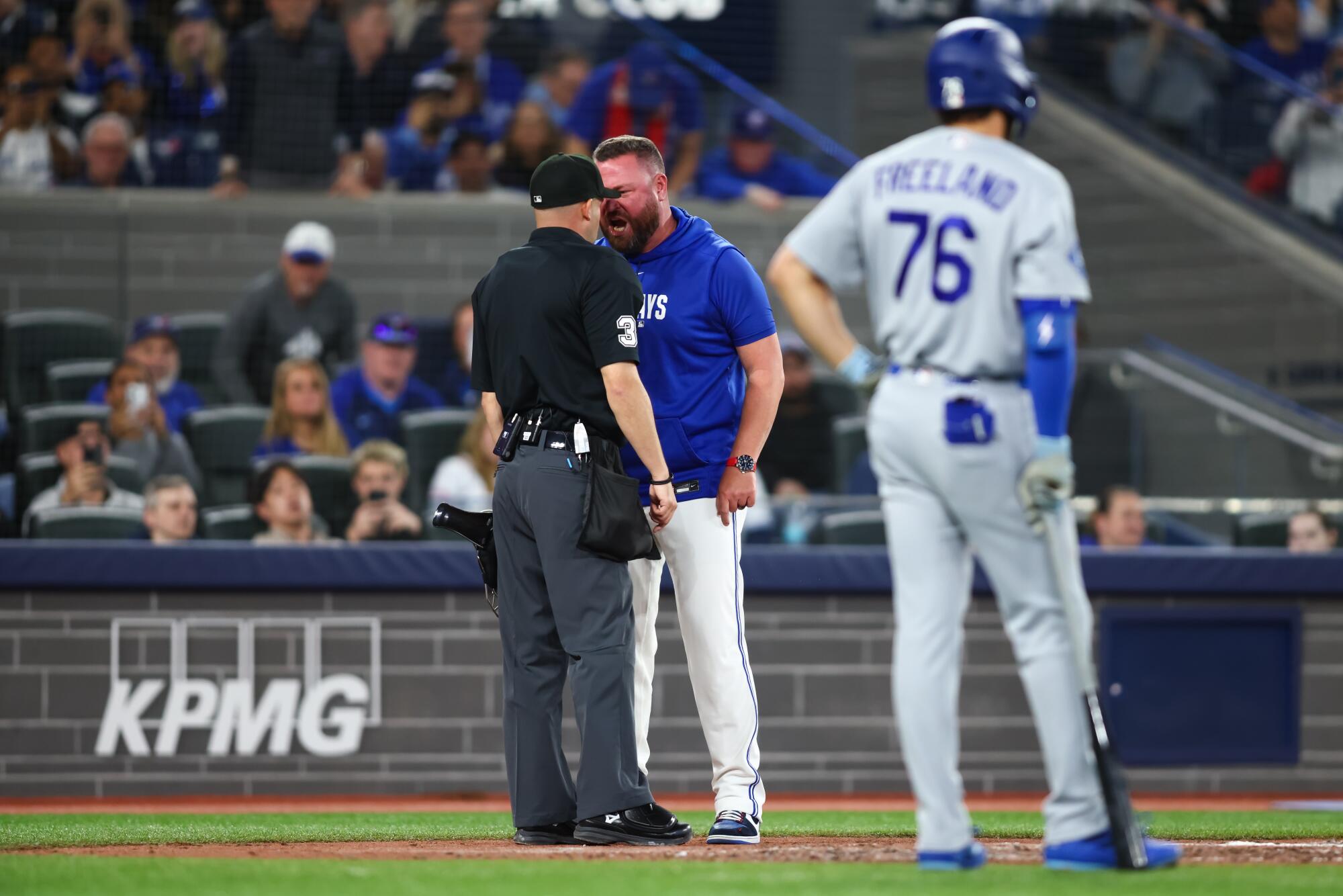 Blue Jays manager John Schneider yells at plate umpire Dan Merzel after being ejected.