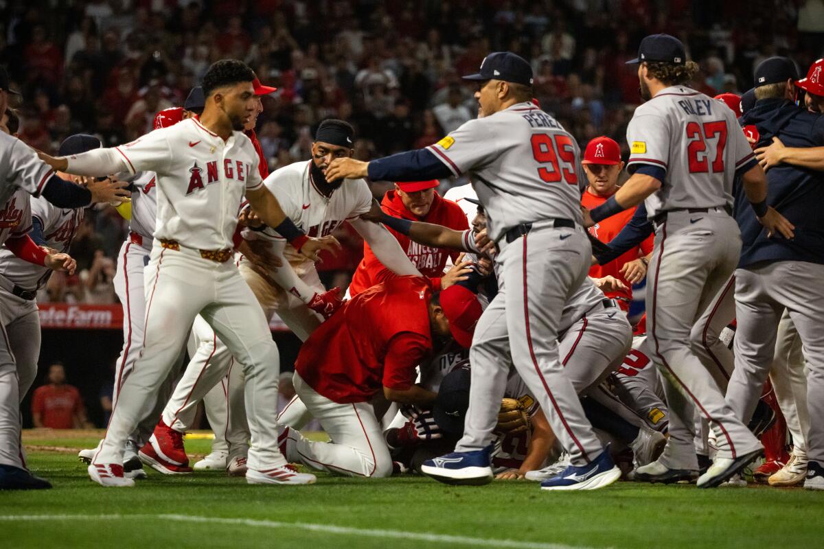 Players on the Angels and Braves rush the field after Jorge Soler and Reynaldo López fight.