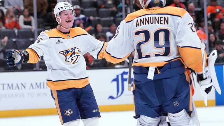 Nashville Predators' right wing Joakim Kemell (25) celebrates with goaltender...