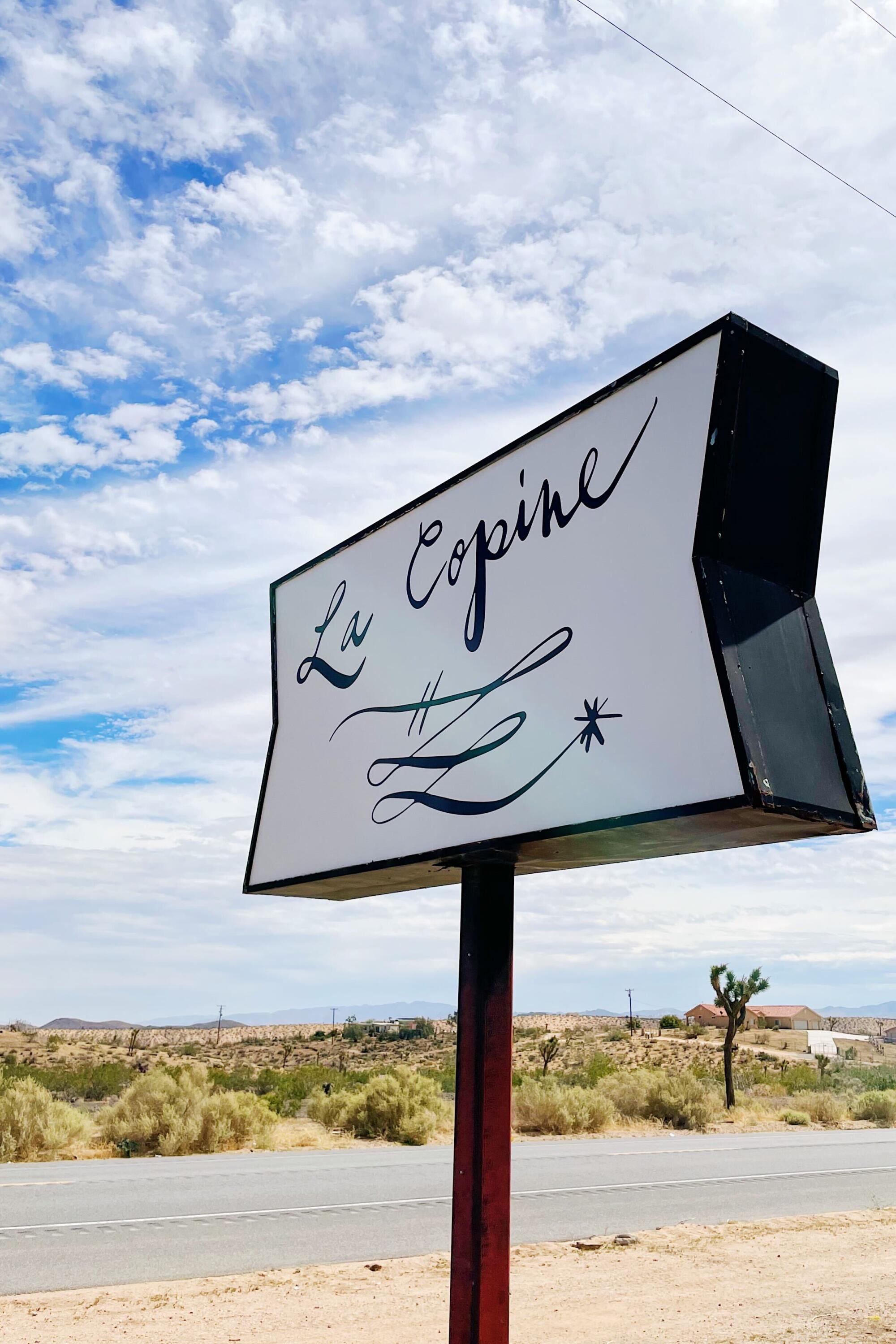 Signage for La Copine, a critically adored restaurant in Yucca Valley.