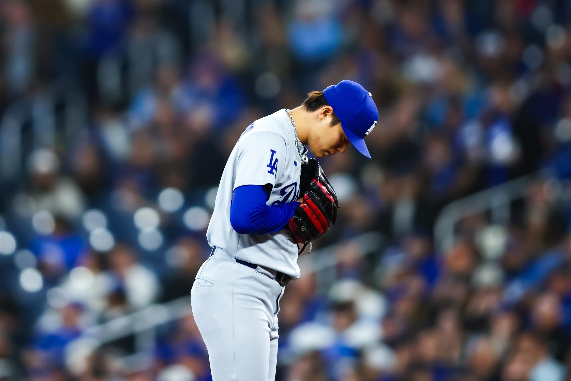 Dodgers pitcher Yoshinobu Yamamoto prepares to deliver in the first inning.