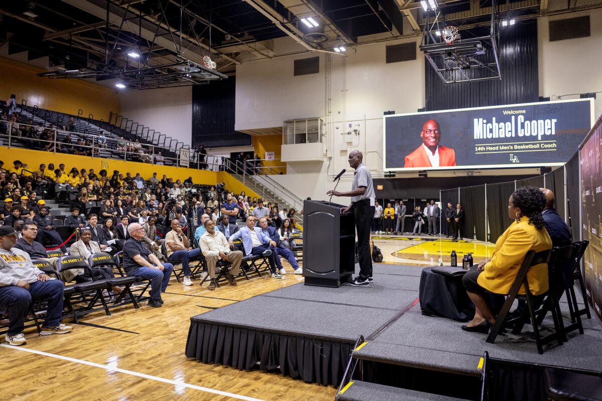 Lakers great Michael Cooper speaks during his introductory news conference Wednesday.