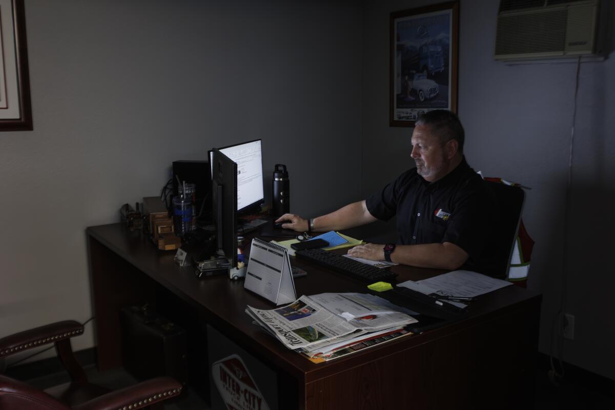 Greg Dubuque, general manager of Liberty Linehaul West, at his office desk.