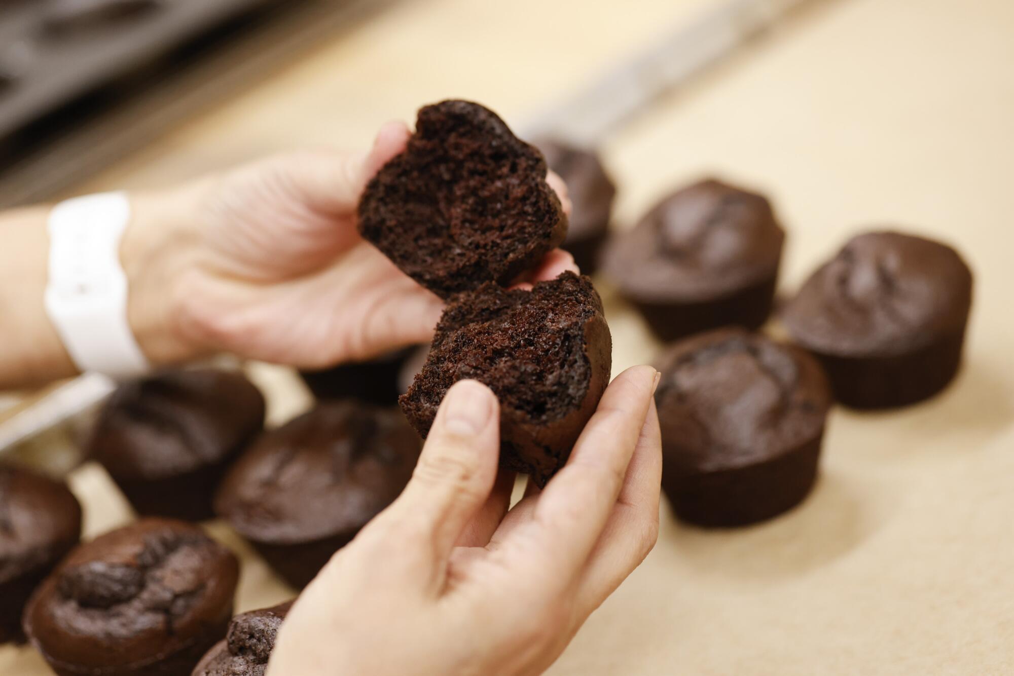 Roxana Jullapat splits open a chocolate muffin at Friends & Family in L.A.