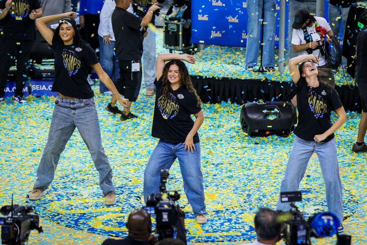 UCLA women’s basketball players (from left) Lauren Betts, Charlisse Leger-Walker and Gabriela Jaquez dance.
