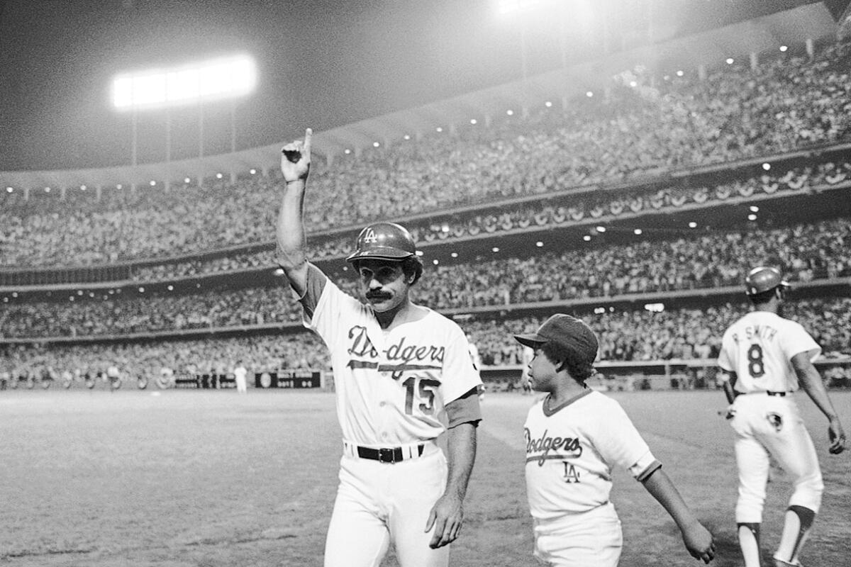 Davey Lopes acknowledges the cheers of the crowd after hitting a home run at Dodger Stadium.
