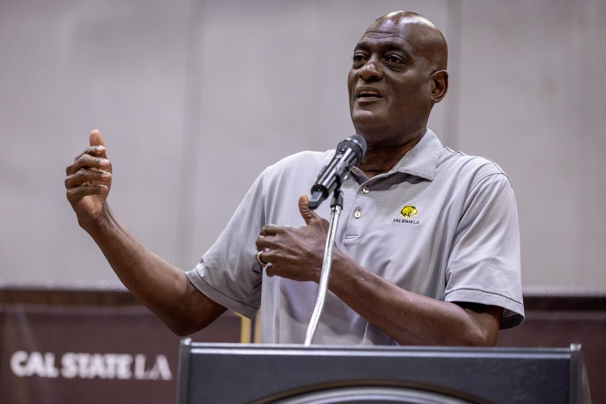 Lakers great Michael Cooper speaks during a news conference at Cal State L.A. on Wednesday.