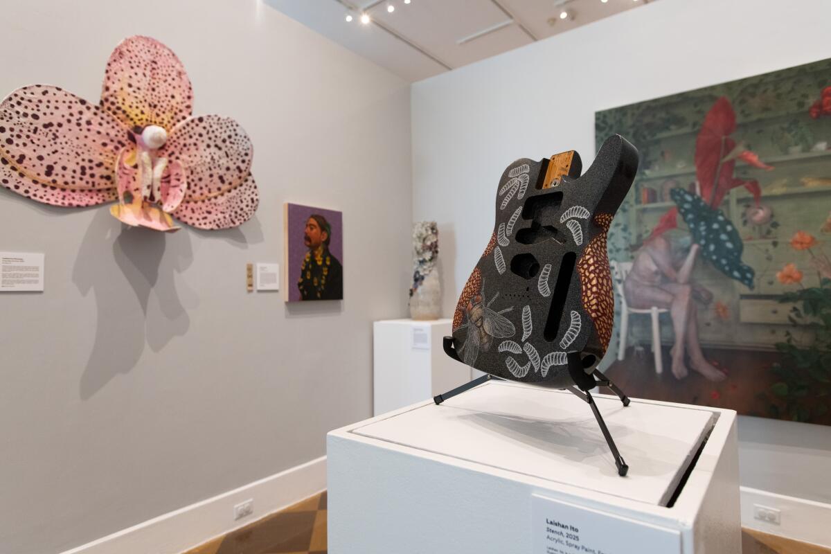 Maggots and flies adorn the body of a telecaster-style guitar in Laishan Ito's "Stench."