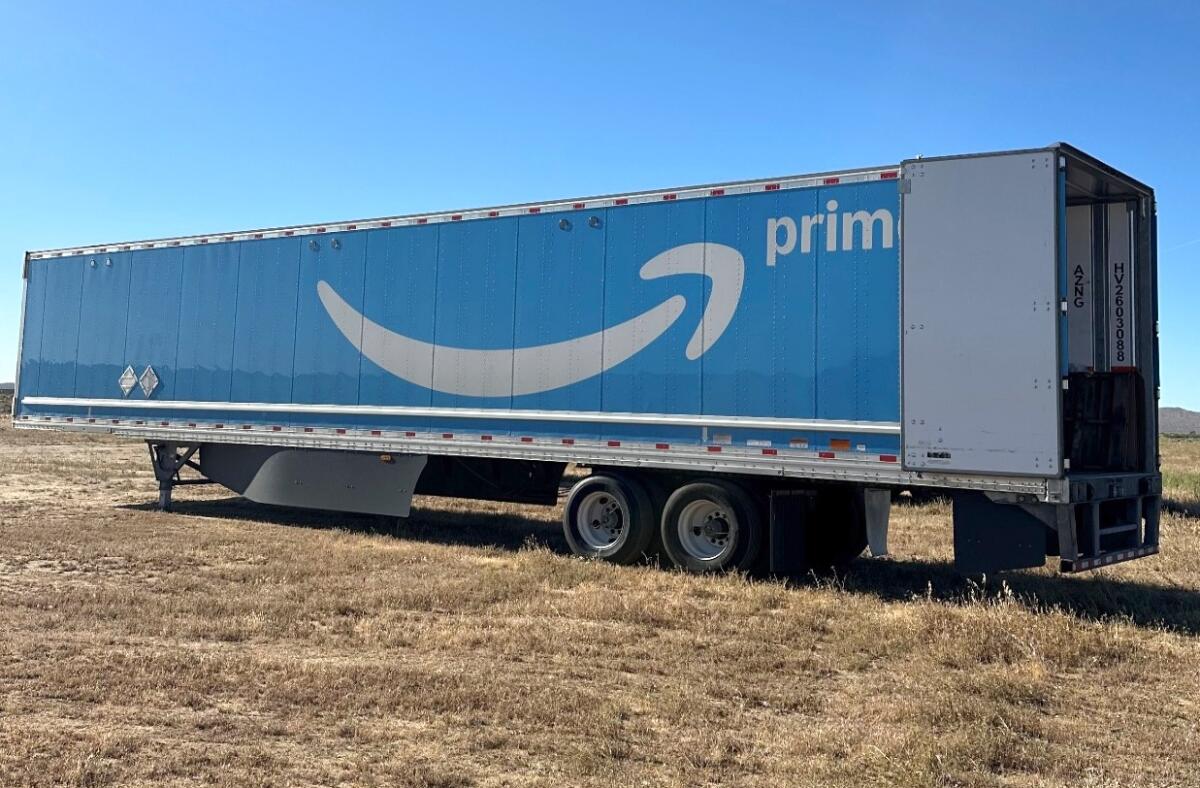 A big rig trailer with an Amazon logo on the side