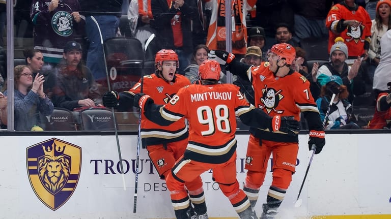 Anaheim Ducks center Leo Carlsson, left, celebrates with defenseman Pavel...