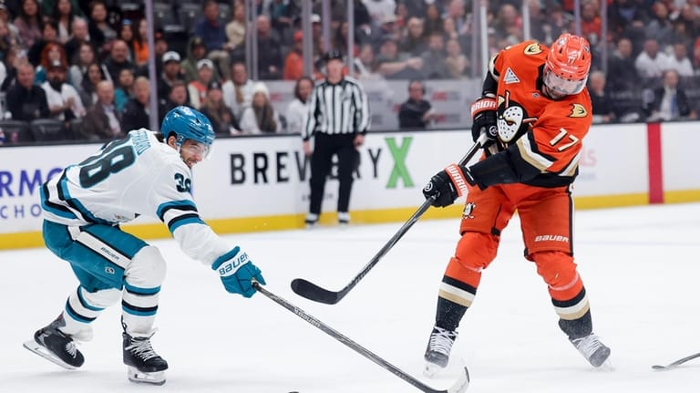 Anaheim Ducks left wing Alex Killorn, right, shoots against San...