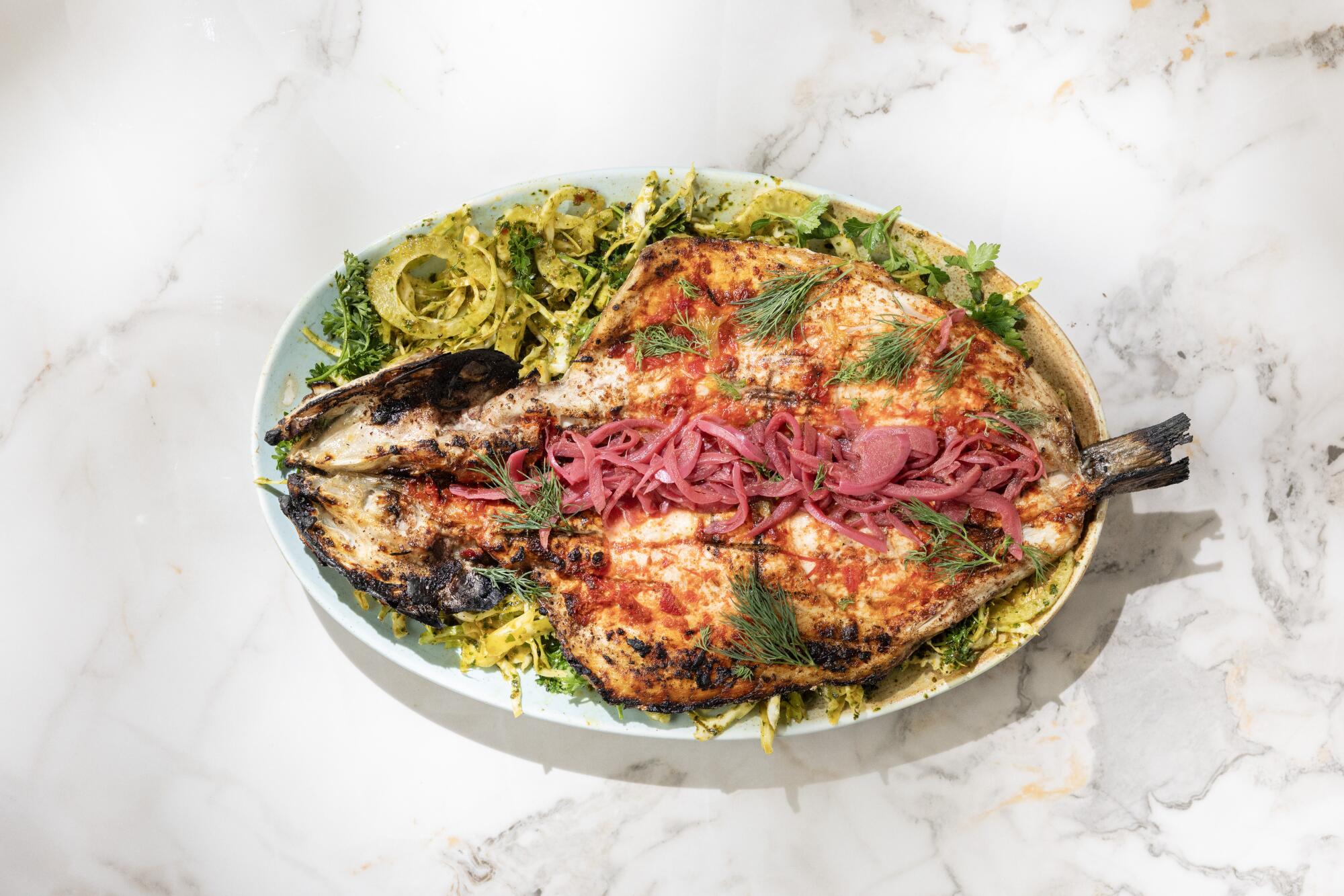 Sayyadiah - grilled butterflied branzino with red shataat Maydan Restaurant