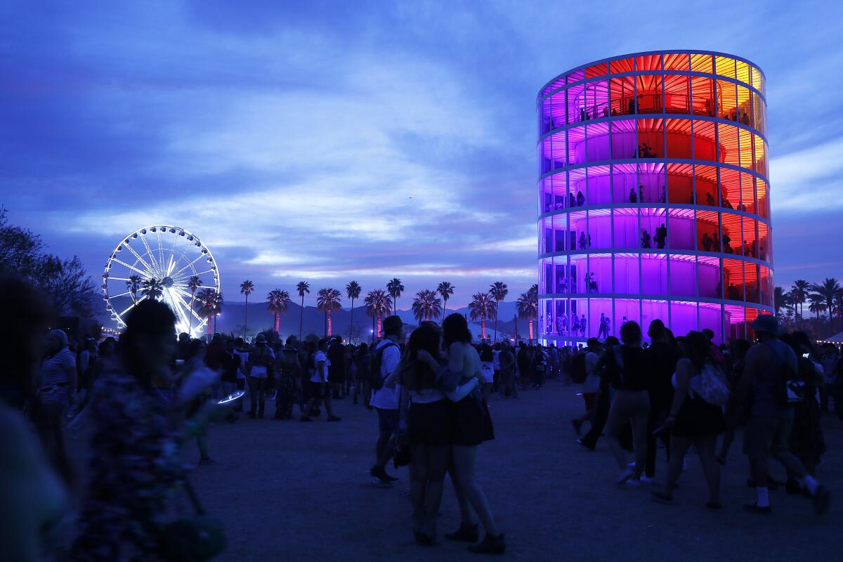 ferris wheel and a cylindrical rainbow tower 