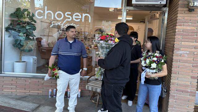 Family and friends gather to remember Martha Hernandez and her 9-year-old son at Chosen Salon in Clovis, where she worked. The pair were killed early Monday in a hit-and-run crash that thrust their car into a Fresno canal.
