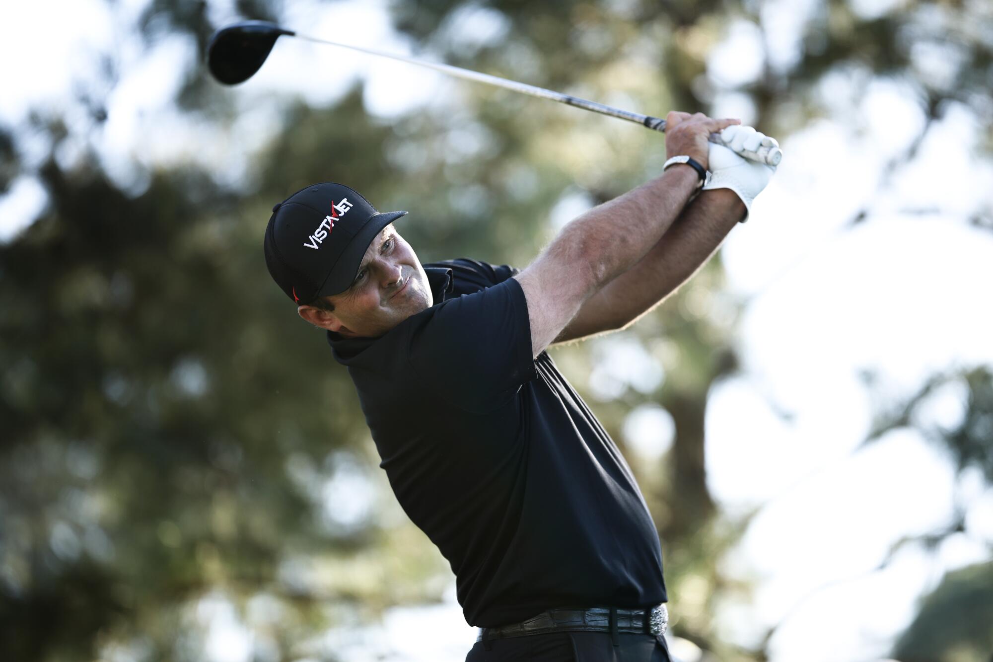 Patrick Reed hits off the 18th tee during the second round of the Masters on Friday.