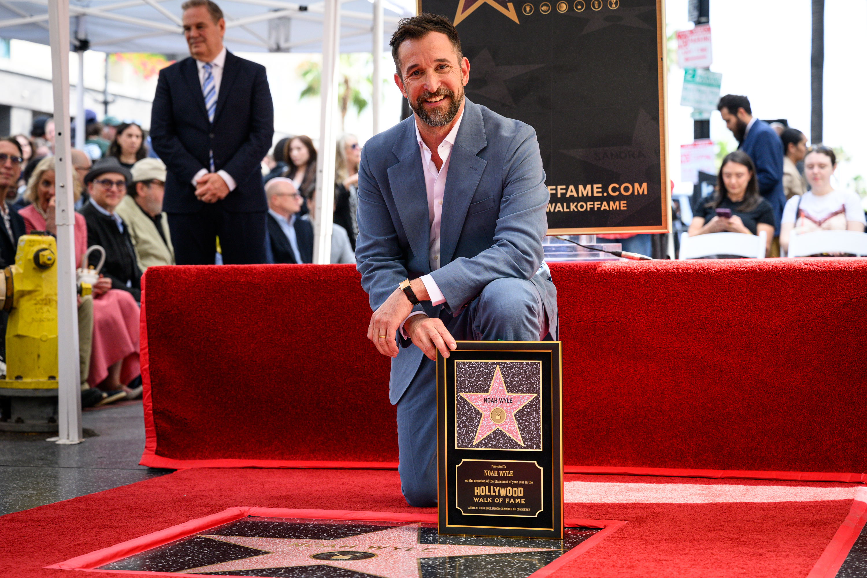 Noah Wyle pose with his star on the Hollywood Walk...