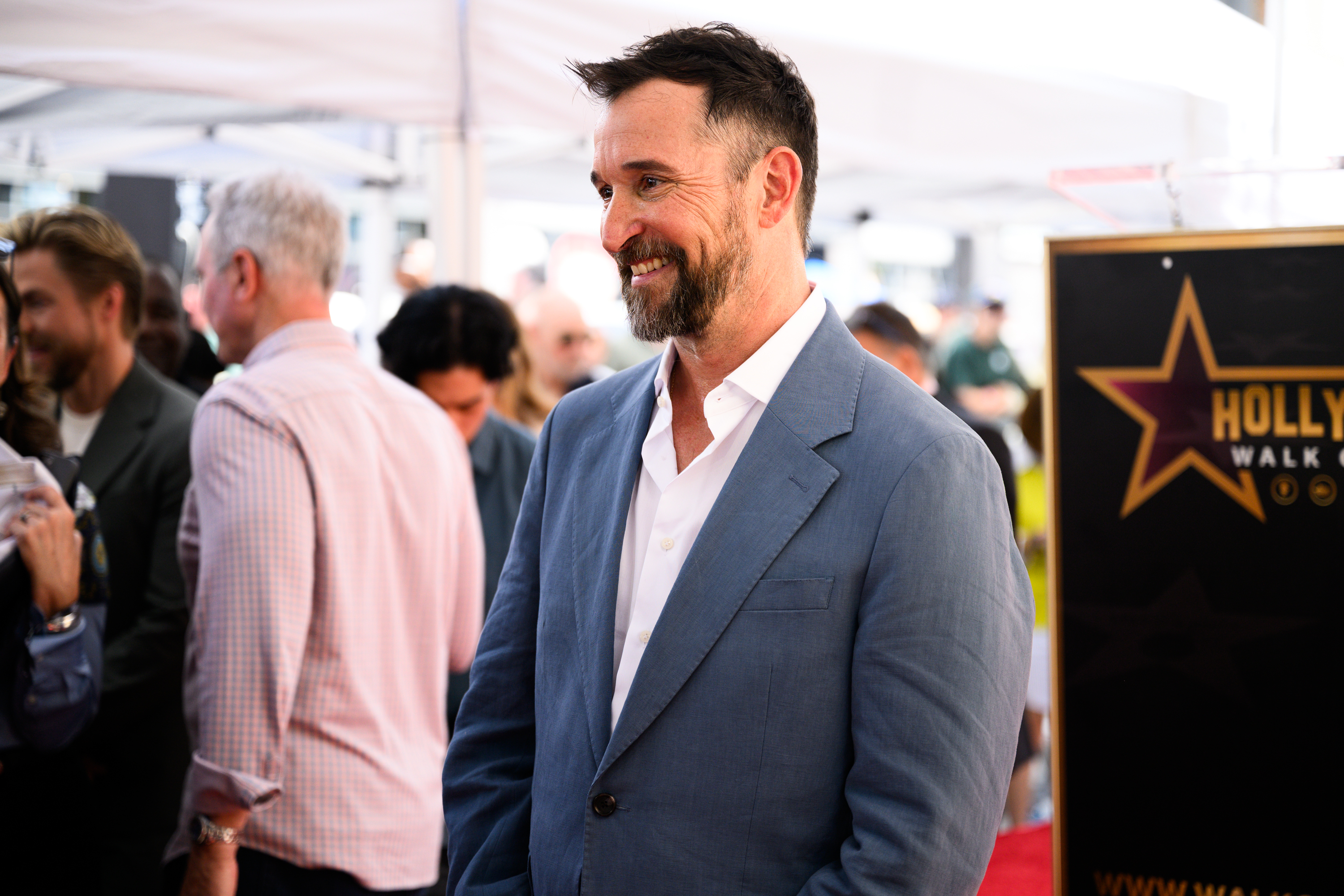 Noah Wyle stands on his Hollywood Walk of Fame on...