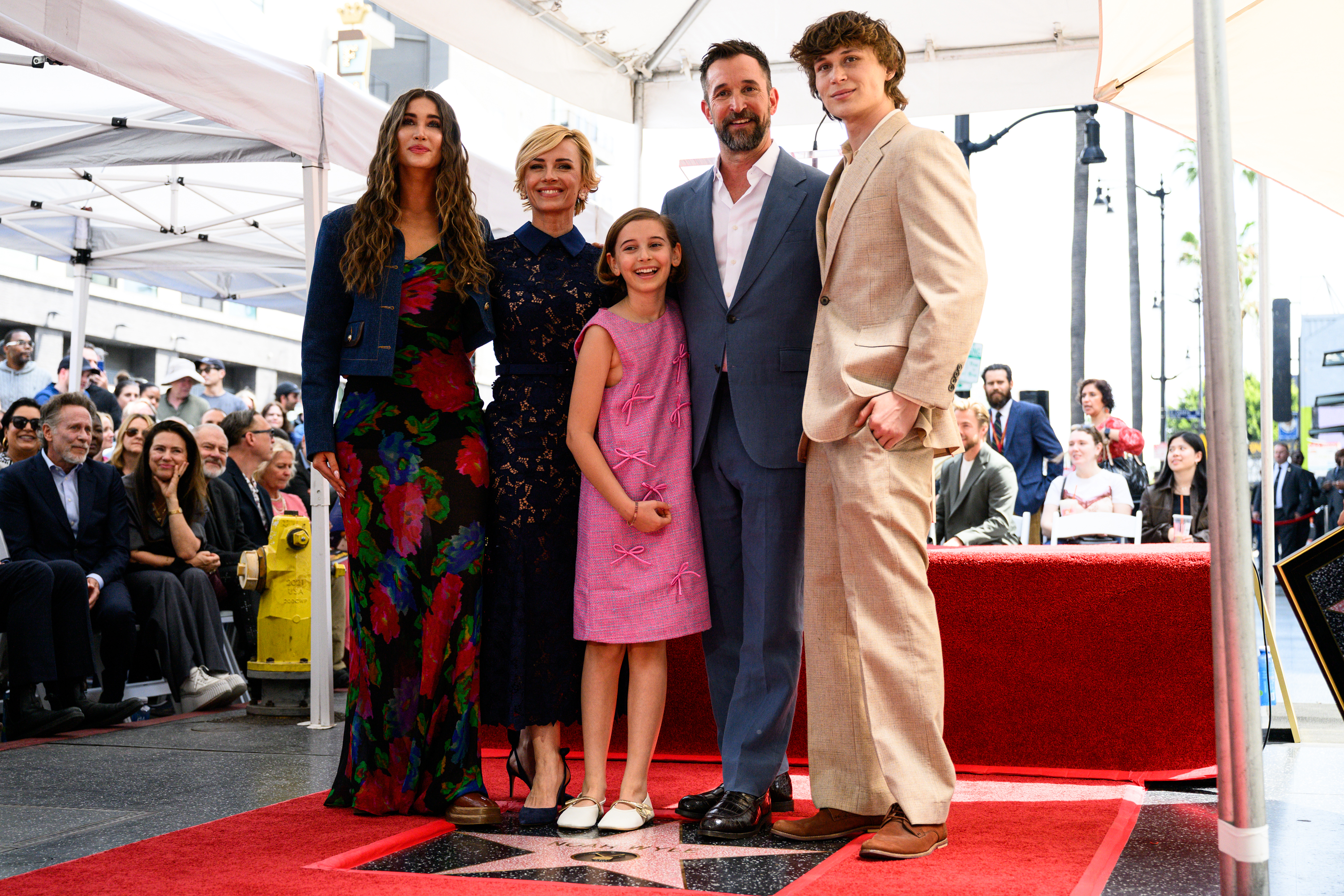 Noah Wyle and his family pose with his star on...