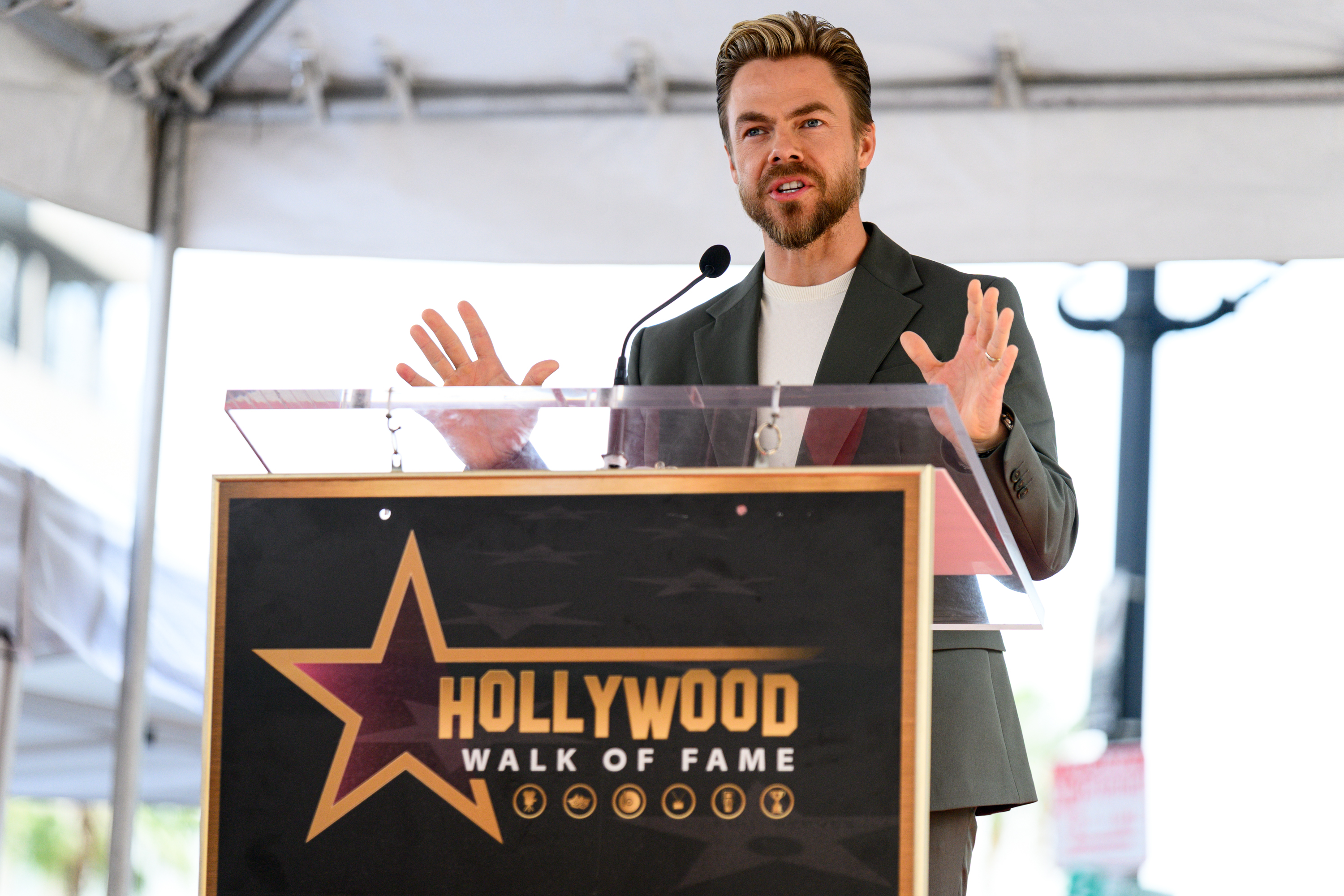 MC Derek Hough speaks at Noah Wyle’s Hollywood Walk of...