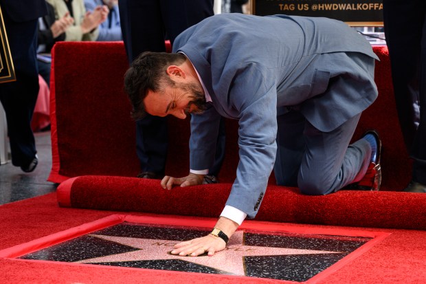 Noah Wyle touches his star on the Hollywood Walk of Fame on Thursday, April 9, 2026. (Photo by Jacob Lewis, Contributing Photographer)