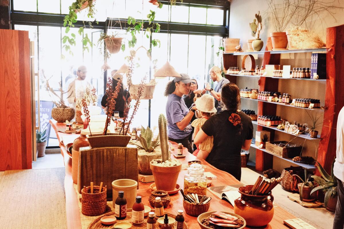 Customers shop at the Noma Projects pop-up shop in Silver Lake