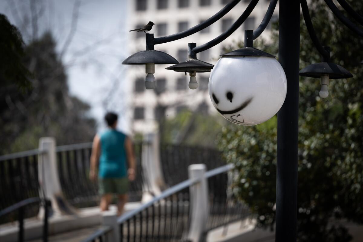 Some of the light globes are broken at the Los Angeles Mall, across the street from Los Angeles City Hall.