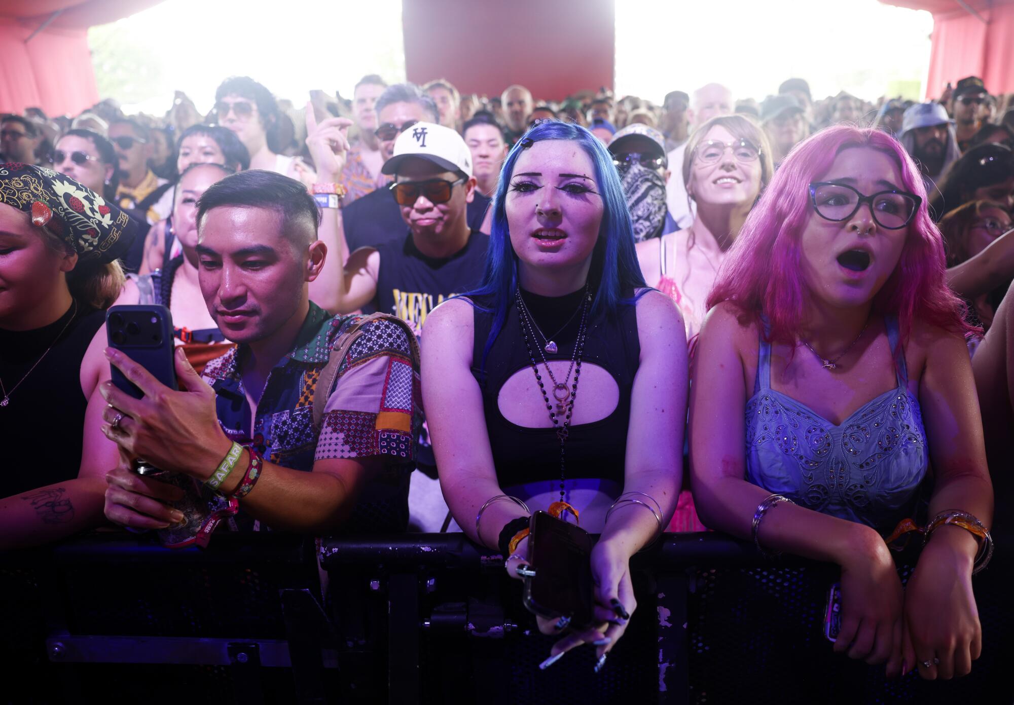 Festival goers react to Bob Baker Marionette's performance.