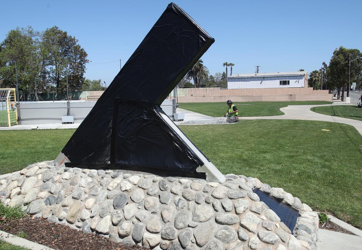 A Cesar Chavez Campesino park sign is covered in black after recent sex abuse allegations.
