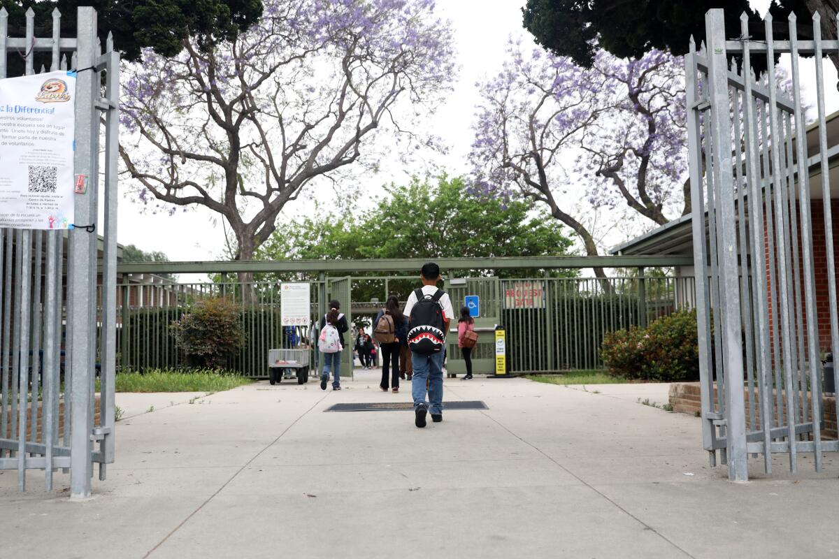 Parents drop their children off at Parmelee Avenue Elementary and Dual Language School in South Los Angeles.
