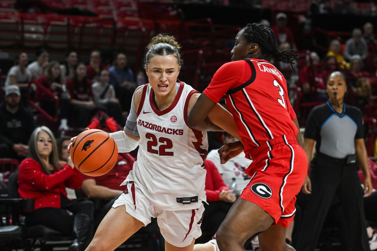 Arkansas guard Bonnie Deas tries to drive past Georgia guard Dani Carnegie on Jan. 22.