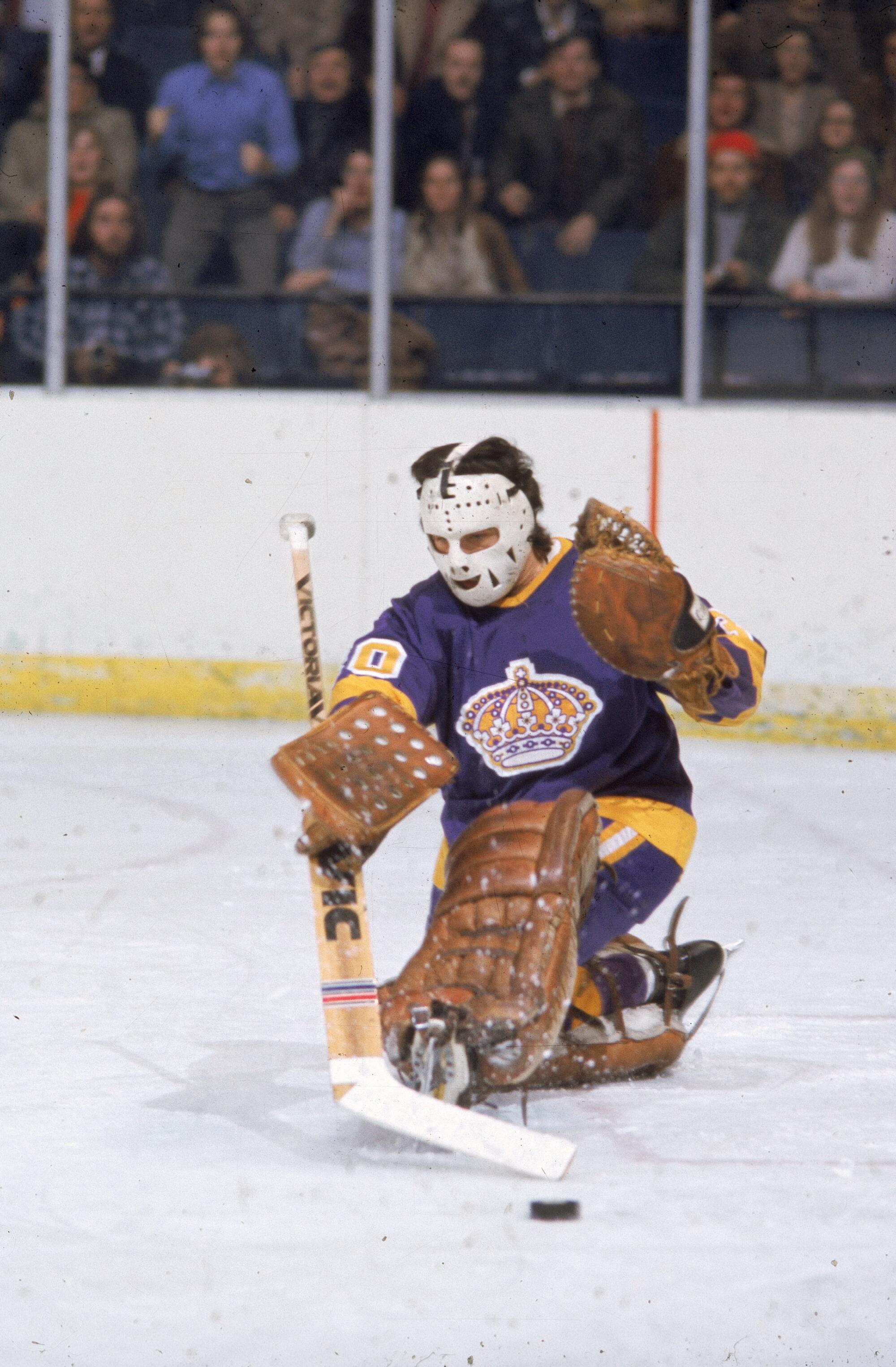 Kings goaltender Rogie Vachon makes a save during a game in the 1970s.