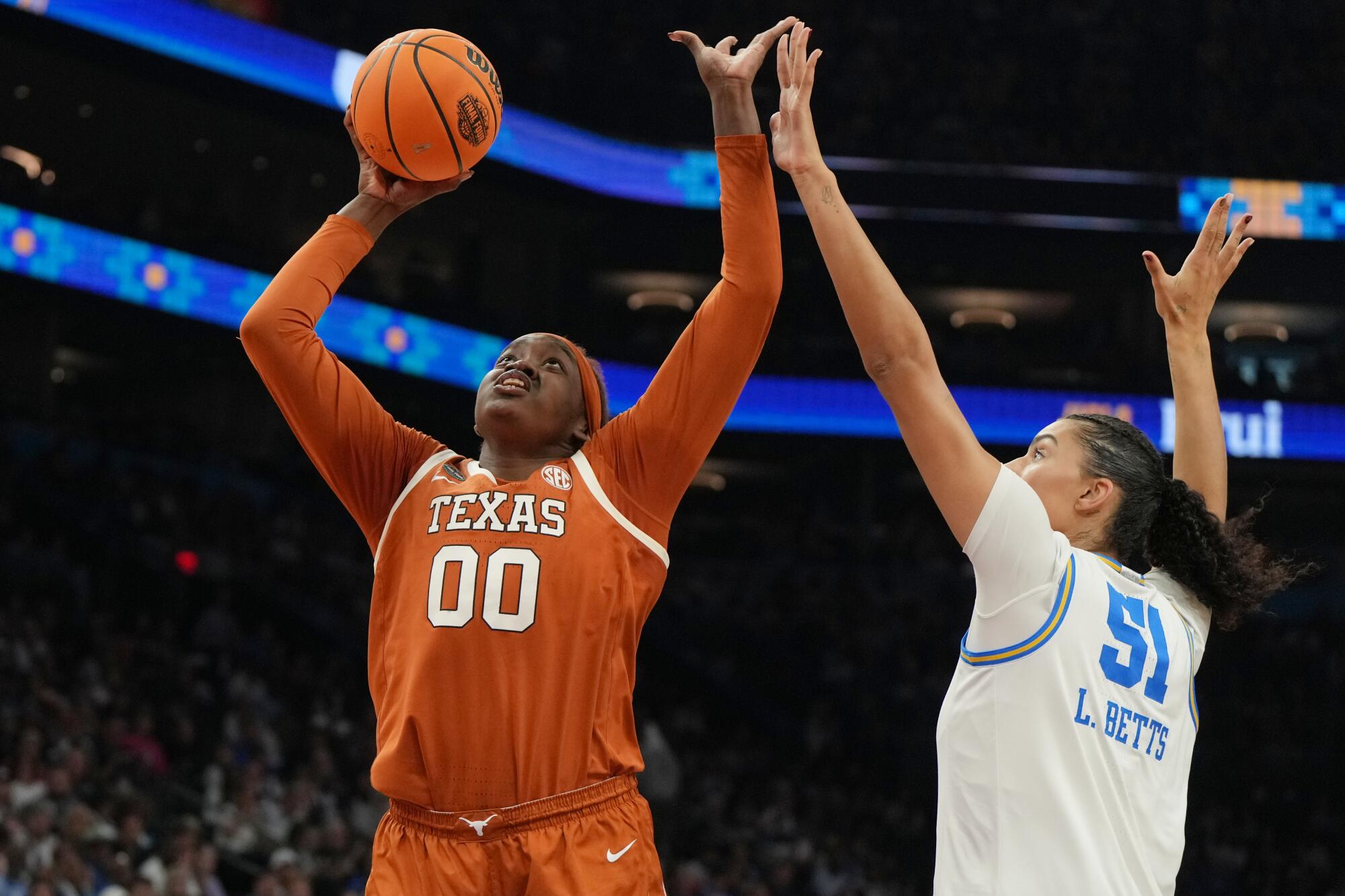 Texas center Kyla Oldacre shoots over UCLA center Lauren Betts during a Final Four game on April 3 in Phoenix. 