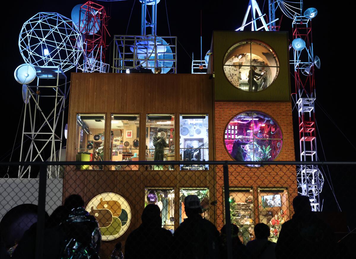 Festival goers observe 'hippos' at exhibit