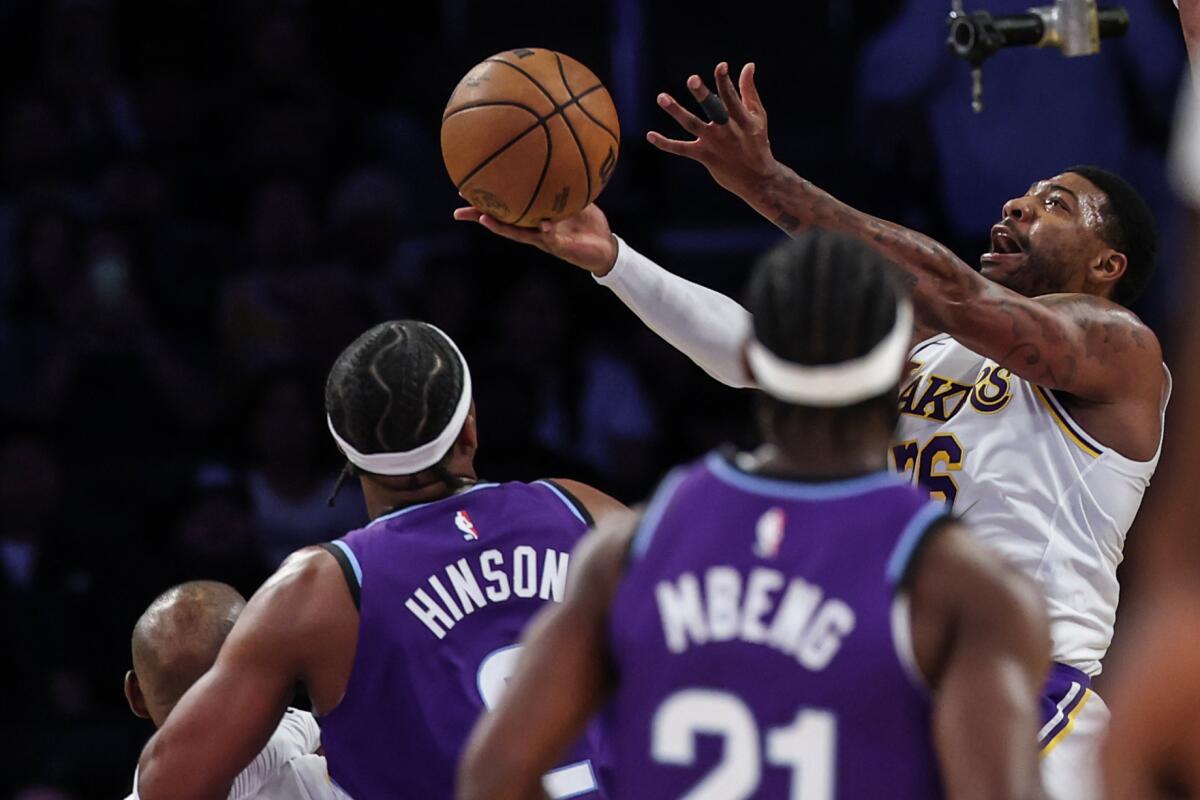 Marcus Smart attempts a reverse layup against the Utah Jazz on Sunday.