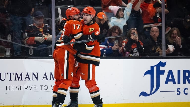 Anaheim Ducks left wing Cutter Gauthier, right, celebrates his goal...