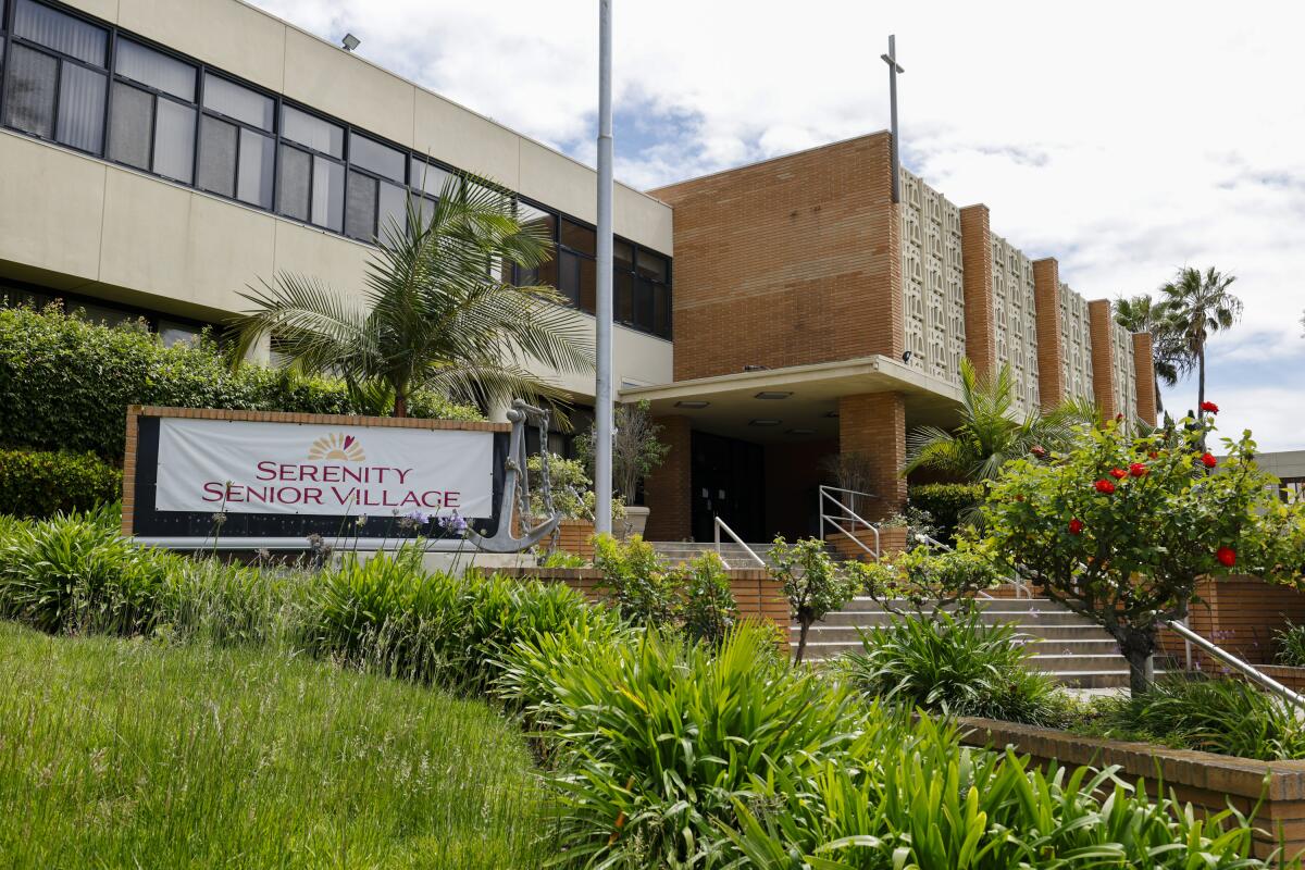 The signage of Serenity Senior Village where demonstrators oppose a proposed drug rehabilitation facility