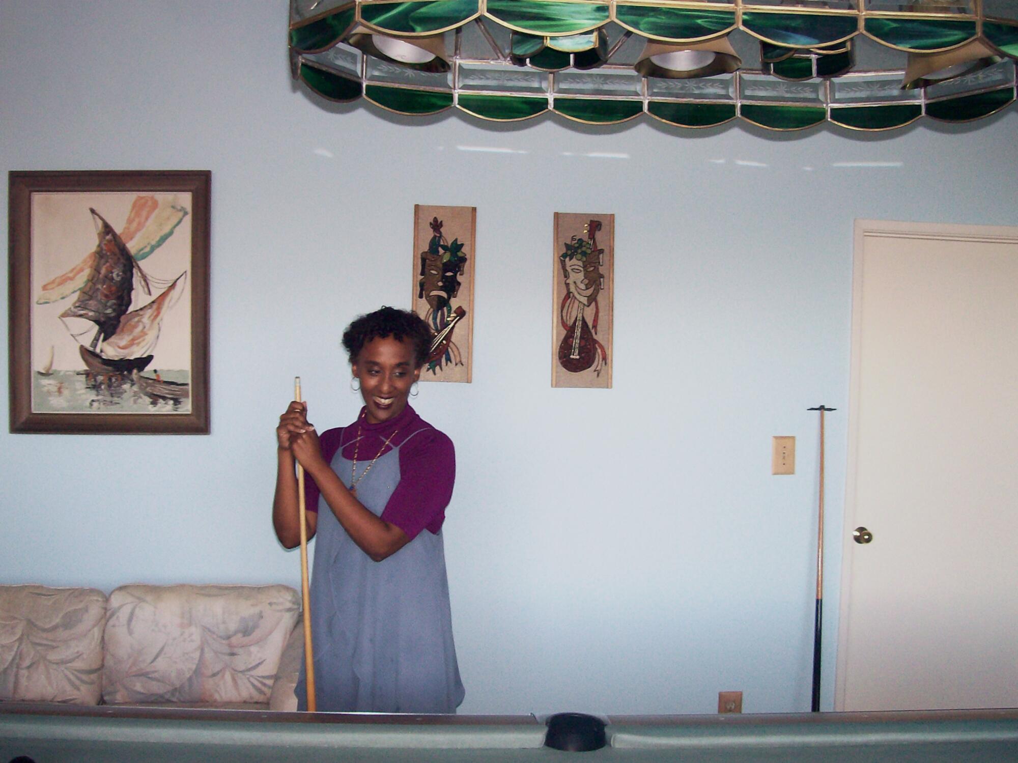 Felema Ye at the pool table inside her home. 