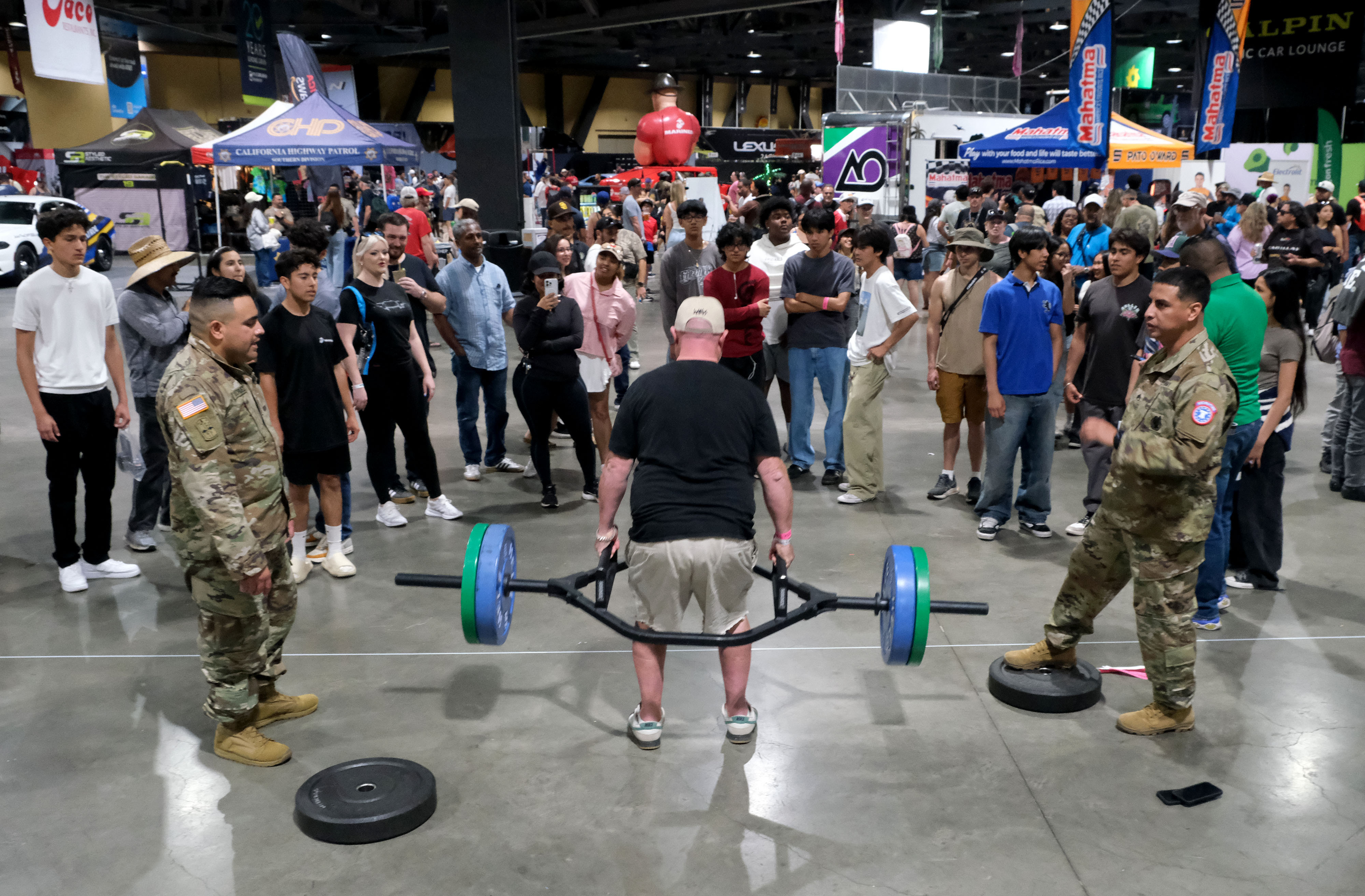 A race fan shows his strength at the U.S. Army...