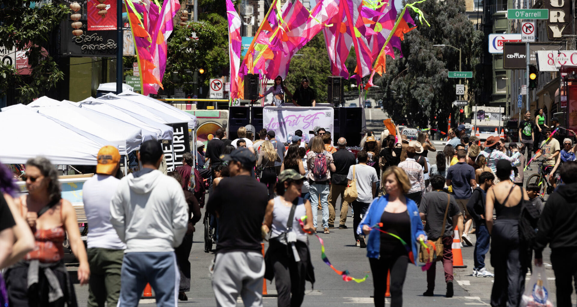 A group gathers at the Love Fest SF block party in the Tenderloin San Francisco. The neighborhood saw significant year-over-year growth in sales tax revenue in 2025, though it still lags behind its 2019 levels.