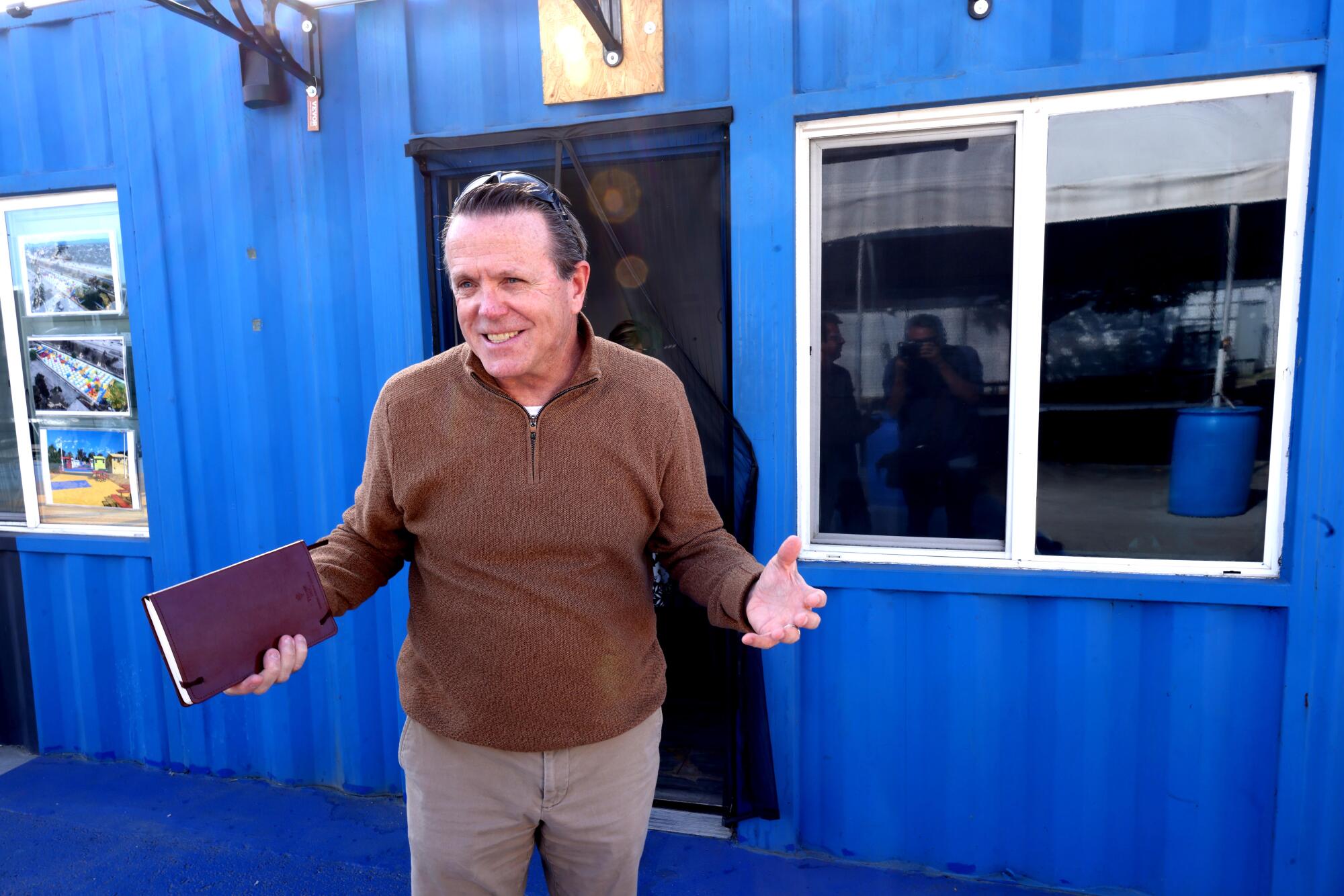 Ken Craft, chief executive of Hope the Mission, visits Alexandria Park Tiny Home Village in North Hollywood.