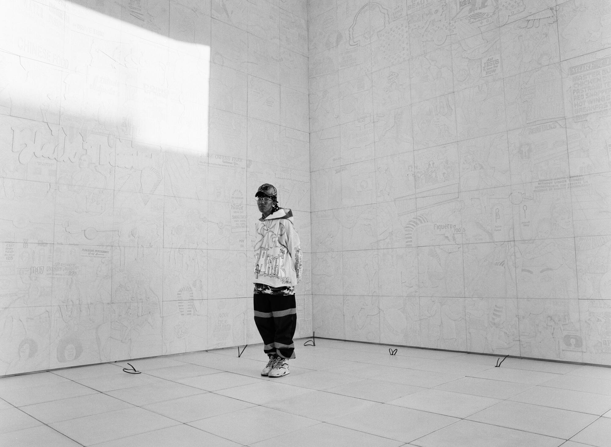 Lauren Halsey stands inside of the oculus at "sister dreamer."