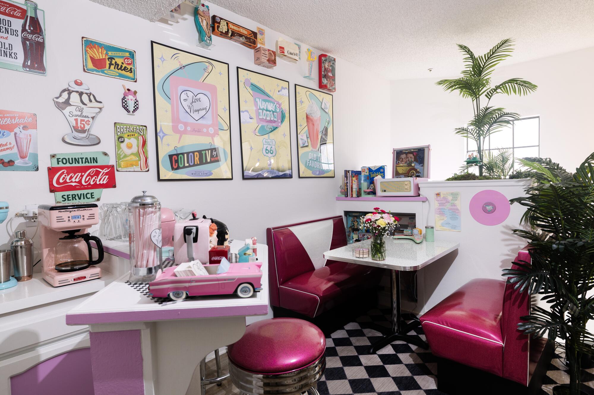 A red and white 1950s-style diner with black and white flooring.