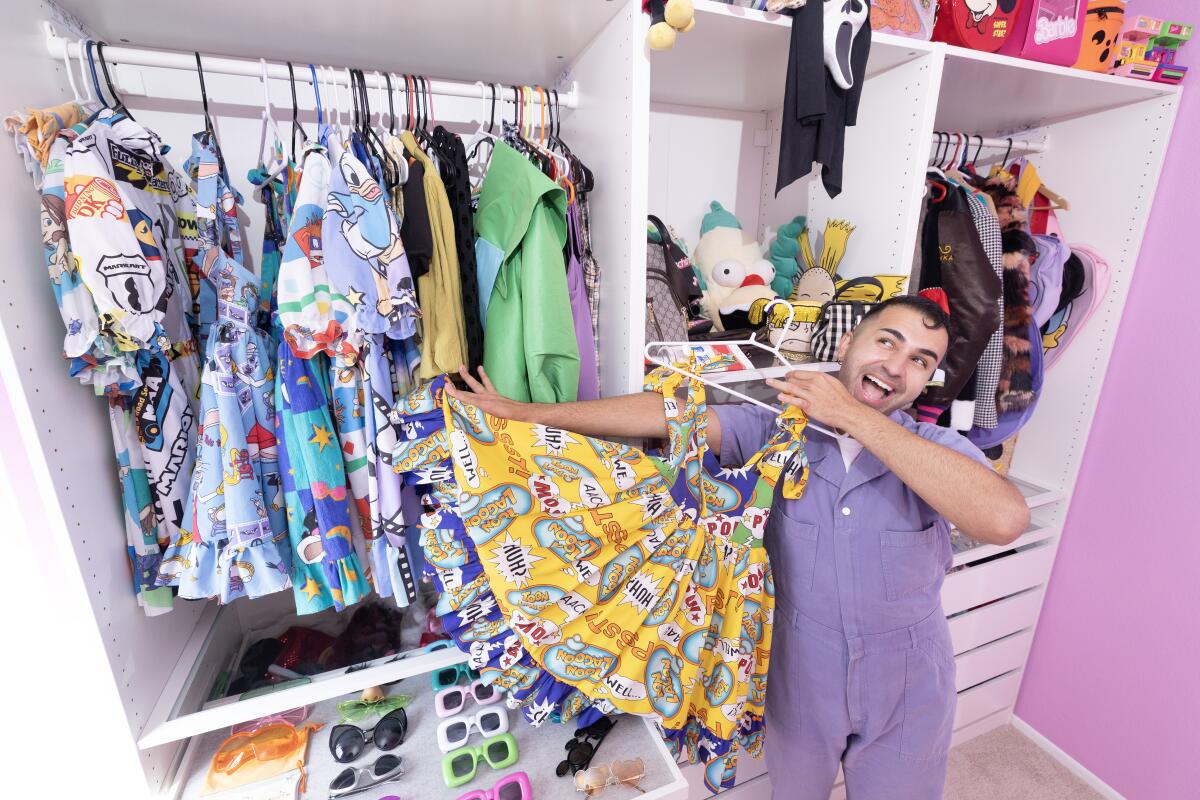 Brandon Shahniani poses with his drag costumes.