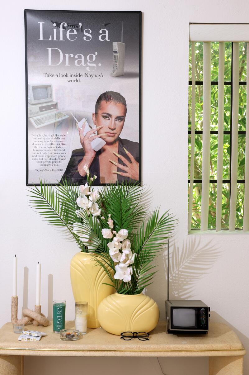 Brandon Shahniani's drag alter-ego 'Naynay hangs on the wall in the 1980s-themed living room.