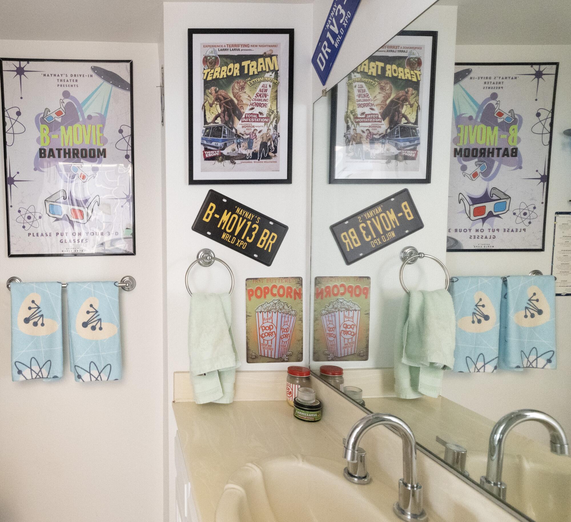 A B movie-themed bathroom with posters and other accessories.