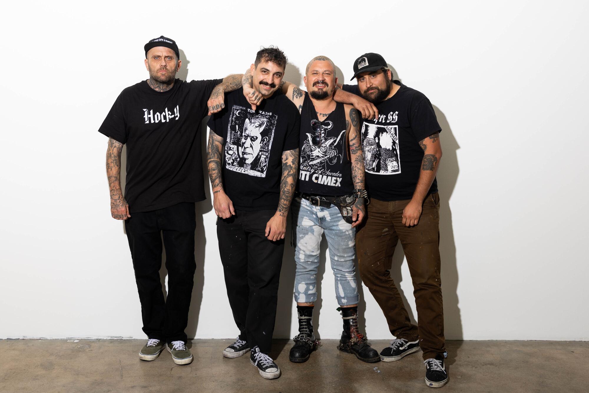 Mike, Grumpy, Meka, and Adrian of the band Dead City Punx pose at Beyond the Streets gallery.