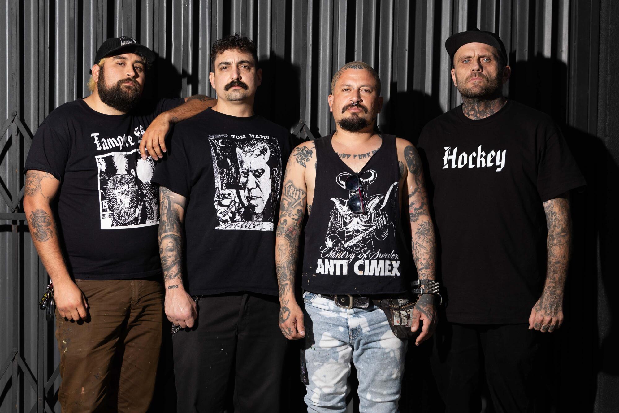 Adrian, Grumpy, Meka and Mike of the band Dead City Punx pose at Beyond the Streets gallery.