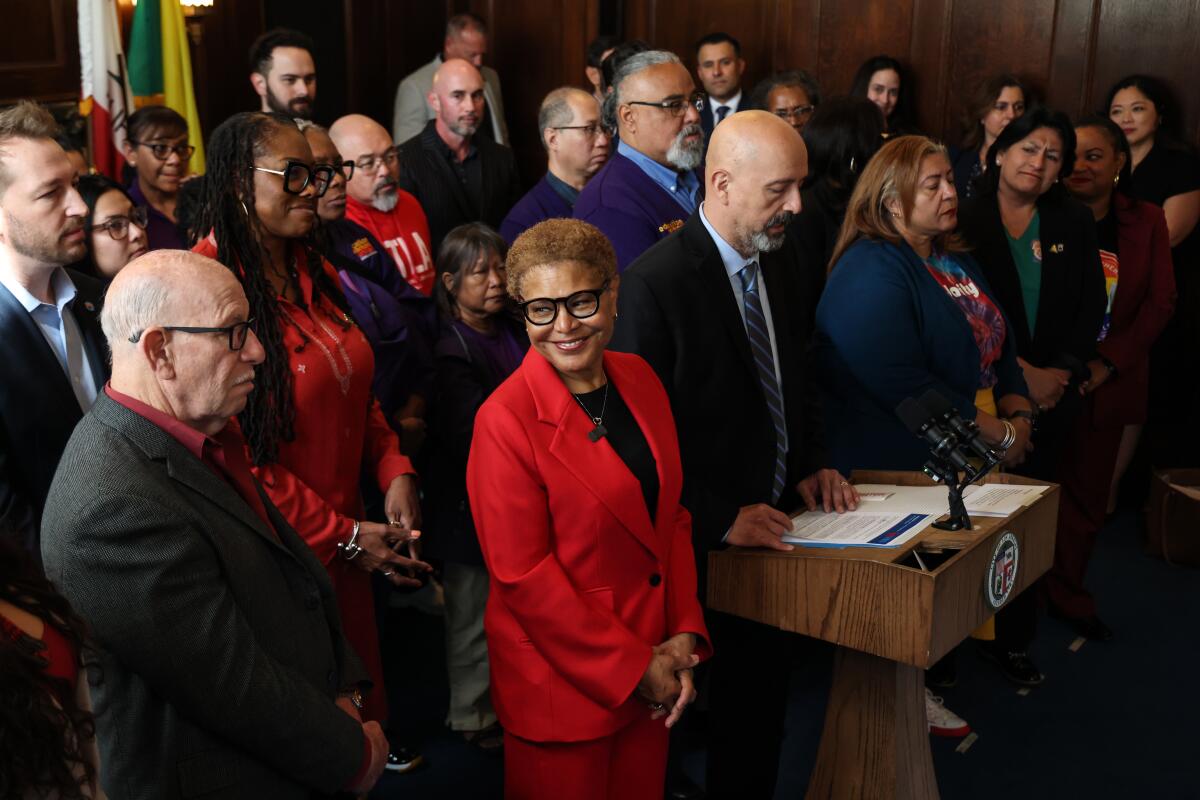 Mayor Karen Bass surrounded by a crowd