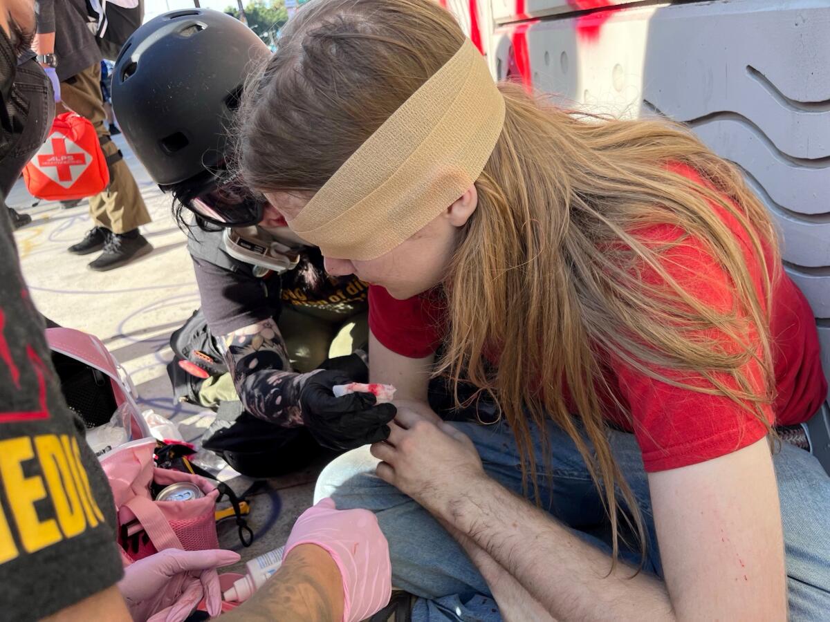 Tucker Collins sitting with a bandage over his right eye